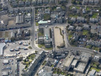 Oblique aerial view centred on the town hall, taken from the NNE.