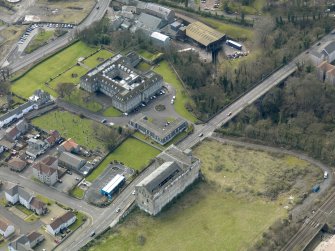 Oblique aerial view centred on Nairn's south factory with the office block adjacent, taken from the NNE.