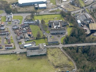 Oblique aerial view centred on Nairn's south factory with the office block adjacent, taken from the WNW.
