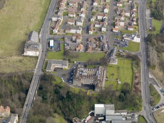 Oblique aerial view centred on Nairn's south factory with the office block adjacent, taken from the SW.
