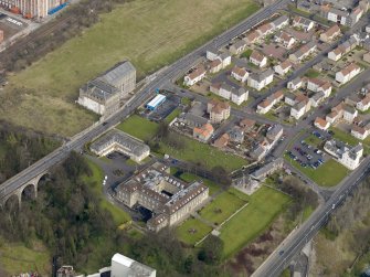 Oblique aerial view centred on Nairn's south factory with the office block adjacent, taken from the SW.