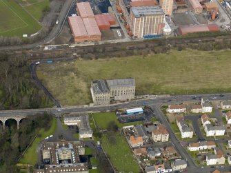 Oblique aerial view centred on Nairn's south factory with the office block adjacent, taken from the S.