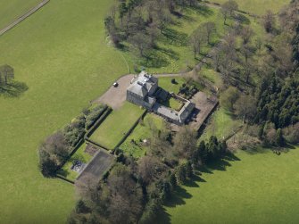 Oblique aerial view of the house with the office court adjacent, taken from the NE.