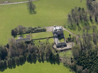 Oblique aerial view of the house with the office court adjacent, taken from the N.