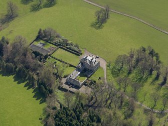 Oblique aerial view of the house with the office court adjacent, taken from the NW.