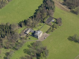 Oblique aerial view of the house with the office court adjacent, taken from the WSW.