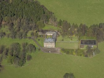 Oblique aerial view of the house with the office court adjacent, taken from the SSE.