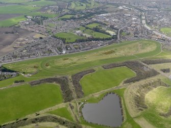 Oblique aerial view centred on the race course, taken from the NE.