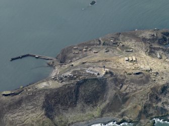 Oblique aerial view centred on Mid and S defences, taken from the E.