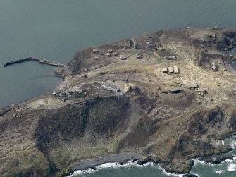 Oblique aerial view centred on the central defences, taken from the SE.