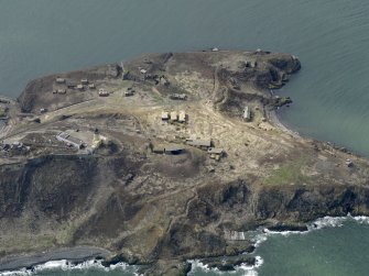 Oblique aerial view centred on the central and northern defences, taken from the SE.