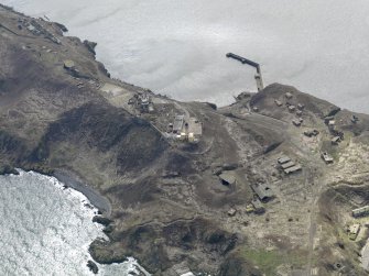 Oblique aerial view centred on the central defences, taken from the NE.