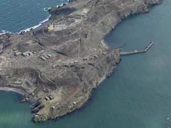 Oblique aerial view centred on Inchkeith northern defences and New Lighthouse, taken from the NW.
