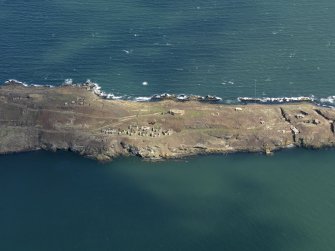 Oblique aerial view centred on S defences, taken from the SW.