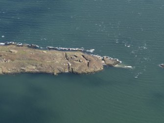 Oblique aerial view centred on S defences, taken from the SW.