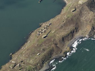 Oblique aerial view centred on S defences, taken from the SE.