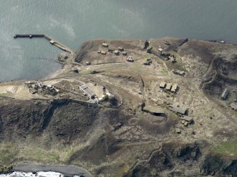 Oblique aerial view centred on the central defences, taken from the E.