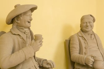 Statues of Tam o' Shanter and Souter Johnie inside Statue House st the Burns Monument in Alloway