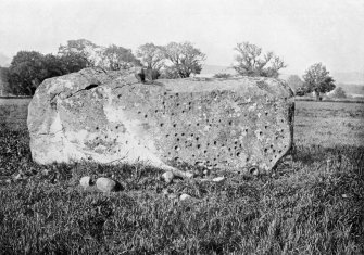 Photograph of recumbent stone at Rothiemay Stone Circle, taken from SW.
Titled: "Rothiemay. Recumbent Stone, cup marked".