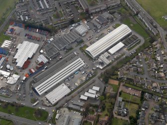 Oblique aerial view centred on the aircraft hangars with Avon Hall adjacent, taken from the N.