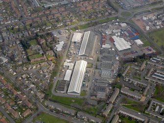 Oblique aerial view centred on the aircraft hangars with Avon Hall adjacent, taken from the SW.