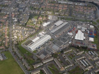 Oblique aerial view centred on the aircraft hangars with Avon Hall adjacent, taken from the SSW.