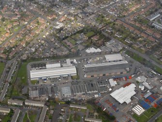 Oblique aerial view centred on the aircraft hangars with Avon Hall adjacent, taken from the SSE.