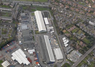 Oblique aerial view centred on the aircraft hangars with Avon Hall adjacent, taken from the NE.