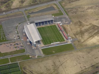Oblique aerial view centred on the football ground, taken from the S.