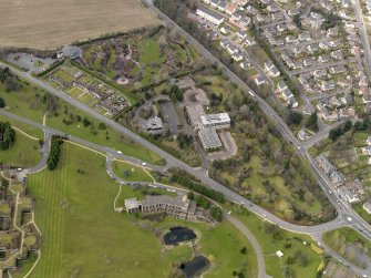 Oblique aerial view centred on the Distillers Head Office with the gardens adjacent, taken from the E.