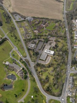 Oblique aerial view centred on the Distillers Head Office with the gardens adjacent, taken from the NE.