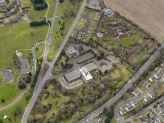 Oblique aerial view centred on the Distillers Head Office with the gardens adjacent, taken from the NNE.