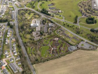 Oblique aerial view centred on the Distillers Head Office with the gardens adjacent, taken from the W.