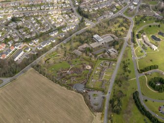 Oblique aerial view centred on the Distillers Head Office with the gardens adjacent, taken from the SW.