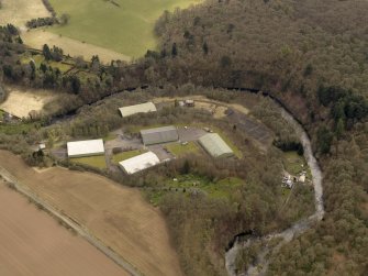Oblique aerial view centred on part of the Naval Stores Depot with Cromwellpark House adjacent , taken from the N.