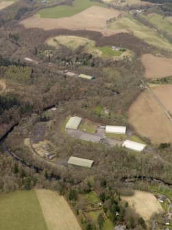 Oblique aerial view centred on part of the Naval Stores Depot with Cromwellpark House adjacent , taken from the S.
