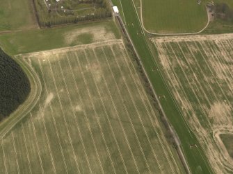 Oblique aerial view centred on the remains of the temporary camp, taken from the NW.