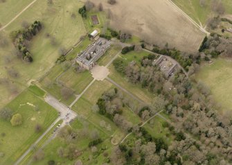 Oblique aerial view centred on the Palace with the Stable Block adjacent, taken from the SE.