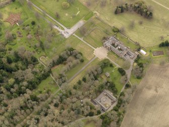 Oblique aerial view centred on the Palace with the Stable Block adjacent, taken from the NNE.