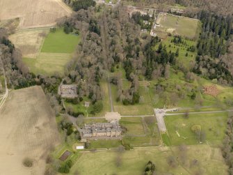 Oblique aerial view centred on the Palace with the Stable Block adjacent, taken from the SW.