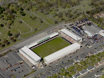 Oblique aerial view centred on the football ground taken from the SSW.