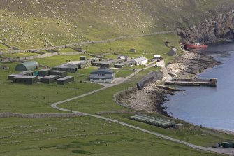 Village Bay, Ministry of Defence Establishment. General elevated view from NW, including the church and manse, the Feather Store, quay and the Spinningdale.