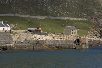 Village Bay, Quay. General view from W with the Feather Store beyond.