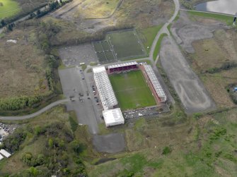 Oblique aerial view centred on the football ground, taken from the N.