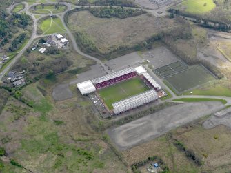 Oblique aerial view centred on the football ground, taken from the WNW.