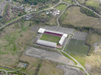 Oblique aerial view centred on the football ground, taken from the SW.