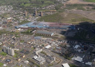 Oblique aerial view of Motherwell centred on the steel works with the Civic Centre adjacent, taken from the S.