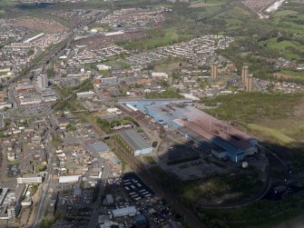 Oblique aerial view centred on the steel works, taken from the SE.