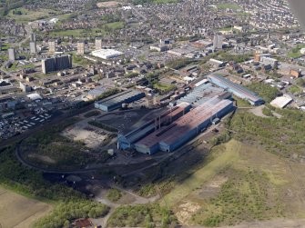 Oblique aerial view centred on the steel works, taken from the ENE.