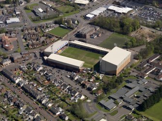 Oblique aerial view centred on the football ground, taken from the WSW.